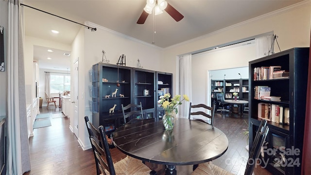 dining area featuring ceiling fan, dark hardwood / wood-style flooring, and ornamental molding