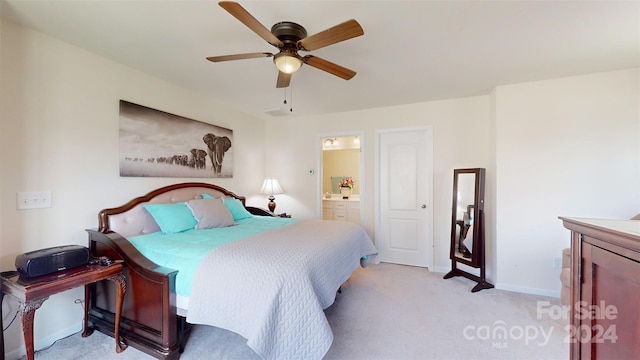 carpeted bedroom featuring ensuite bathroom and ceiling fan