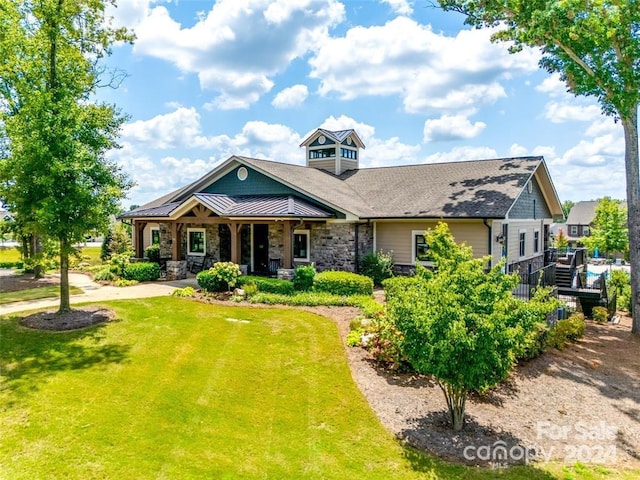 craftsman-style house featuring a front lawn