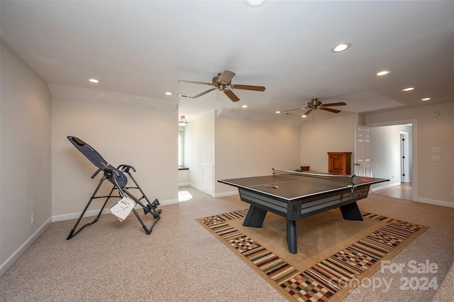 playroom featuring light carpet and ceiling fan