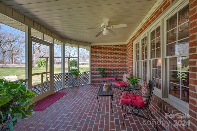 sunroom / solarium with ceiling fan