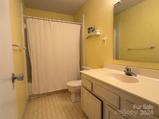 full bathroom featuring shower / bathtub combination with curtain, vanity, and toilet