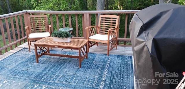 wooden terrace featuring grilling area