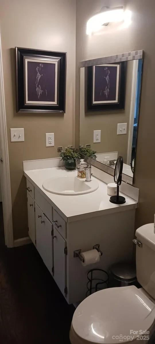 bathroom featuring vanity and toilet