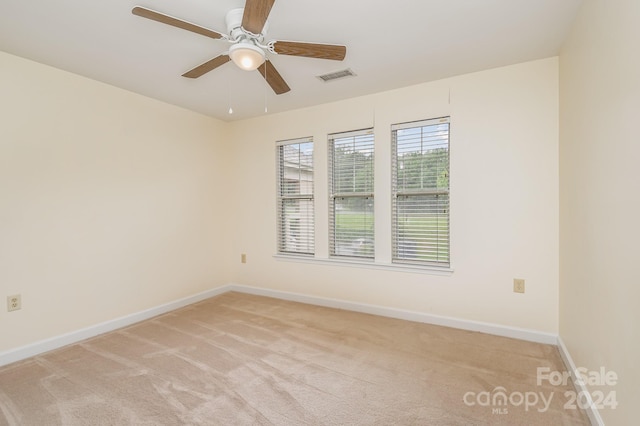 carpeted empty room with ceiling fan