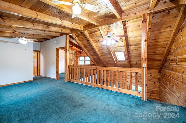 additional living space with ceiling fan, dark carpet, and wooden ceiling