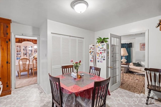 dining space featuring french doors