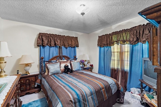 carpeted bedroom with a textured ceiling