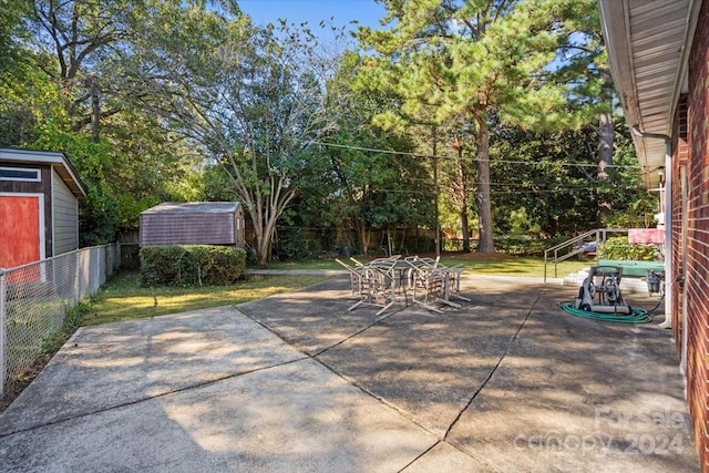 view of patio / terrace featuring a shed