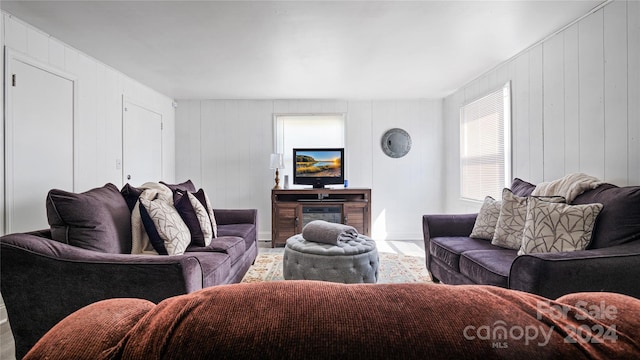 living room featuring wooden walls