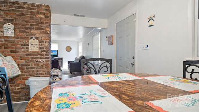 dining area with hardwood / wood-style flooring