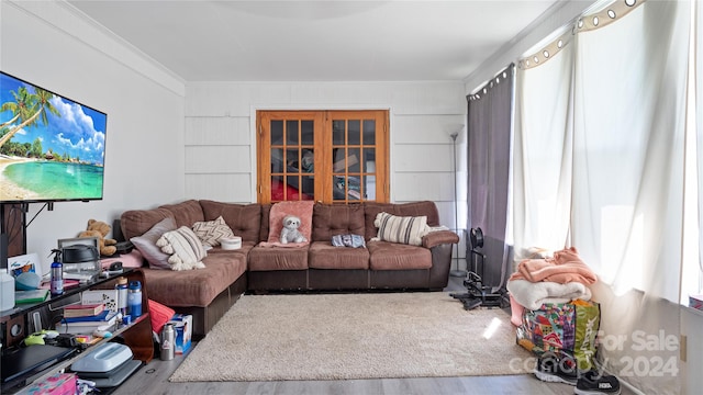 living room featuring ornamental molding and hardwood / wood-style floors