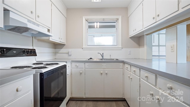 kitchen featuring white cabinetry, white electric range oven, sink, and plenty of natural light