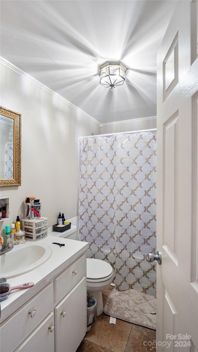 bathroom featuring a shower with shower curtain, toilet, vanity, crown molding, and tile patterned flooring