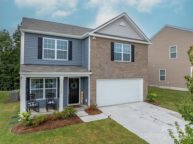 front facade with a garage, central AC, and a front yard