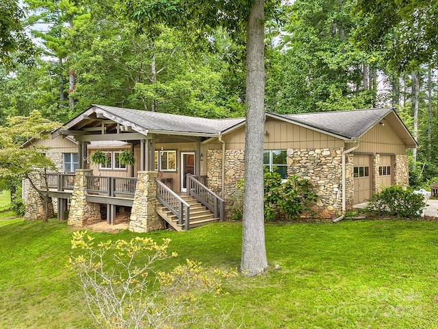 view of front of house with a front yard and a garage