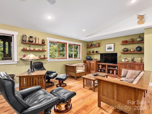 interior space with lofted ceiling and light wood-type flooring