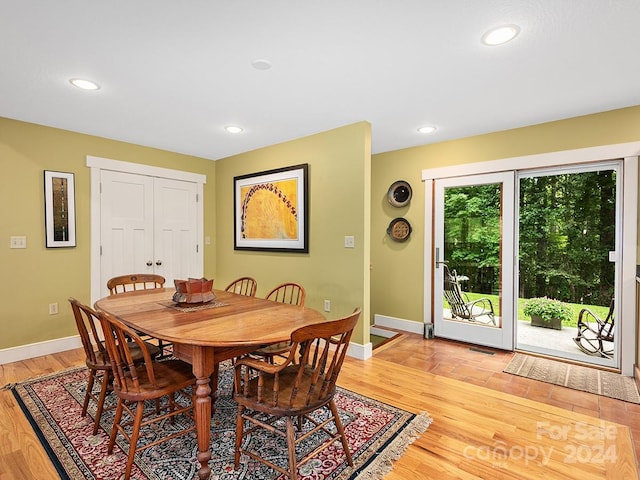 dining area with light hardwood / wood-style flooring