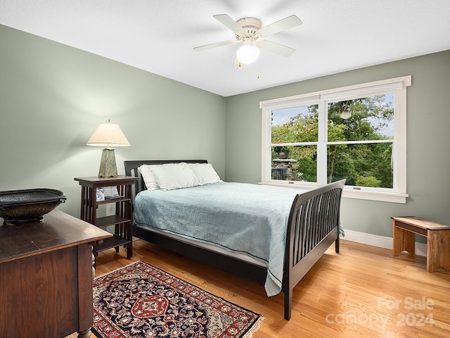 bedroom featuring light hardwood / wood-style flooring and ceiling fan