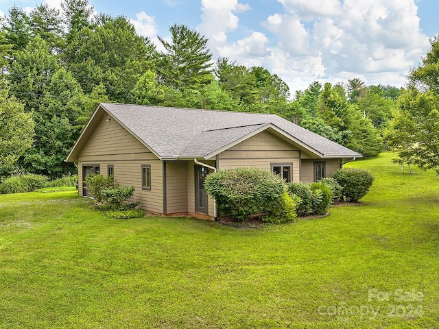 view of home's exterior featuring a lawn