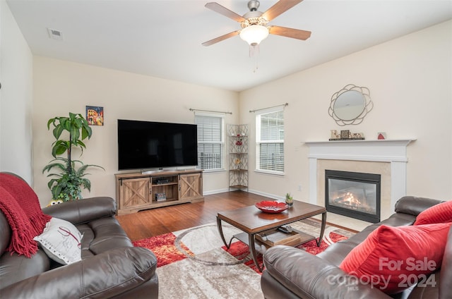 living room featuring ceiling fan and hardwood / wood-style flooring