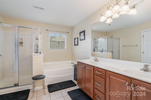 bathroom featuring an inviting chandelier, vanity, separate shower and tub, and tile patterned floors