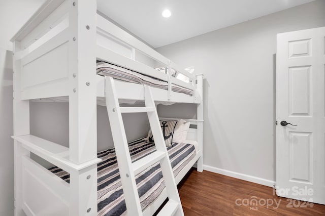 bedroom featuring dark hardwood / wood-style floors