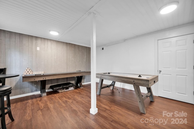 playroom featuring wooden walls and hardwood / wood-style flooring