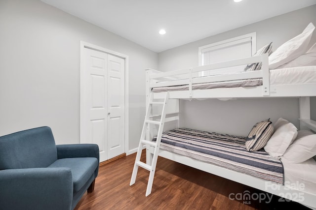 bedroom featuring recessed lighting, a closet, and wood finished floors