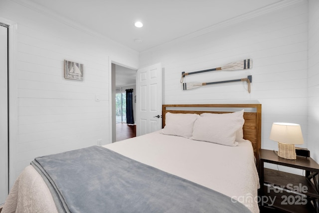 bedroom with recessed lighting and ornamental molding