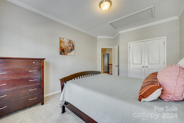 carpeted bedroom featuring a closet and ornamental molding