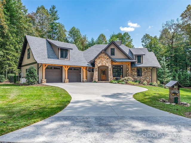 craftsman house with a front yard and central AC unit