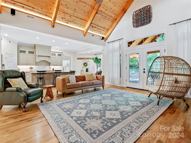 living room with beam ceiling, high vaulted ceiling, wooden ceiling, light hardwood / wood-style floors, and french doors