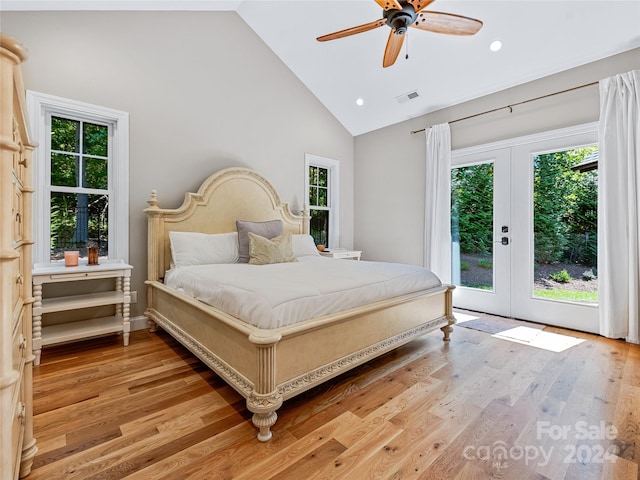 bedroom with french doors, access to exterior, ceiling fan, light hardwood / wood-style floors, and high vaulted ceiling