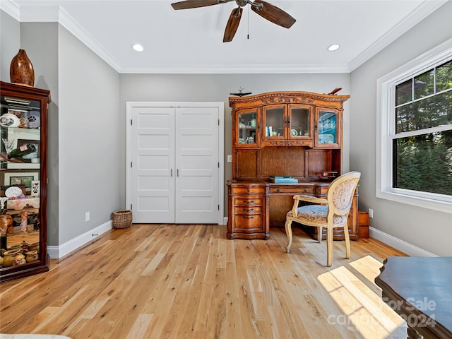 office area featuring light hardwood / wood-style floors, crown molding, and ceiling fan