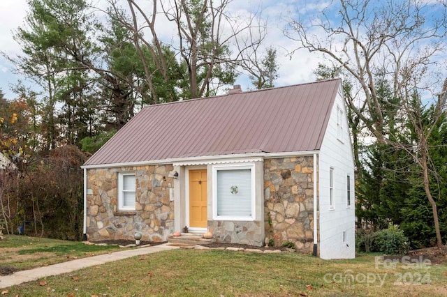 21 Lakeshore Dr, Asheville, NC 28804 - view of front of home with stone siding, a front lawn, metal roof, and entry steps
