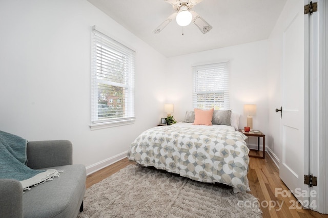 21 Lakeshore Dr, Asheville, NC 28804 - bedroom featuring multiple windows, light wood finished floors, and baseboards