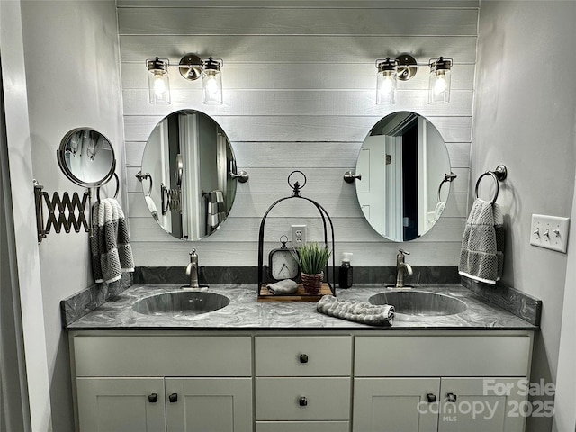 bathroom featuring double vanity and a sink