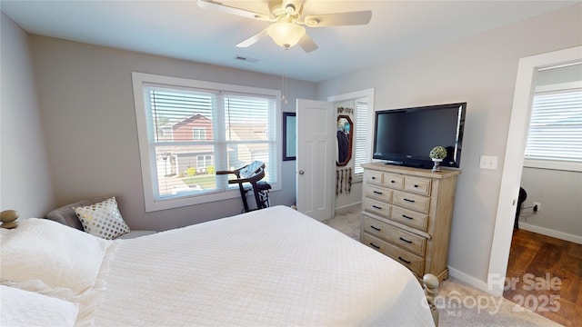 bedroom featuring visible vents, baseboards, and ceiling fan