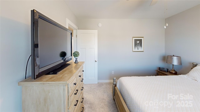 bedroom with carpet, baseboards, and ceiling fan