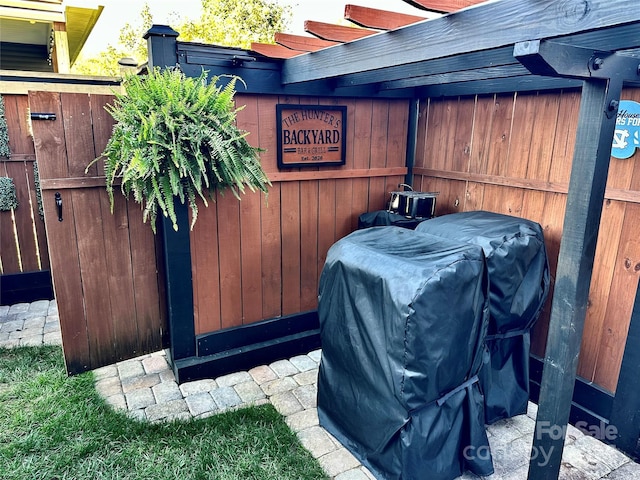 exterior space with a grill