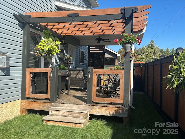 wooden deck with a pergola, fence, and a ceiling fan
