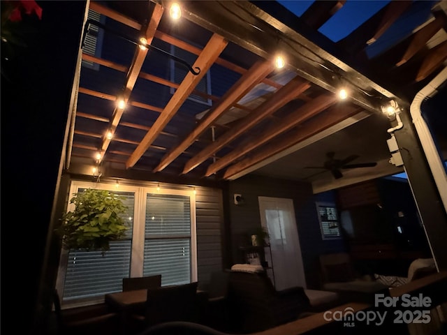 exterior space with ceiling fan
