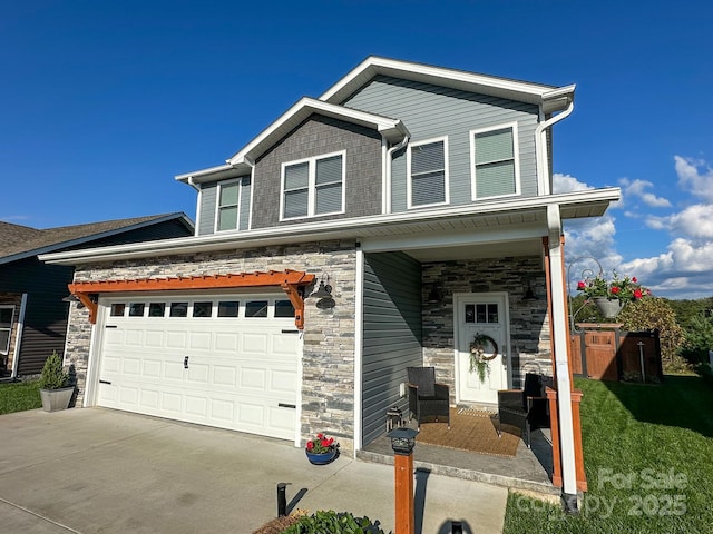 craftsman house featuring a porch, stone siding, a garage, and driveway