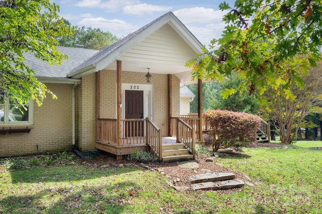 exterior space featuring a porch and a front lawn