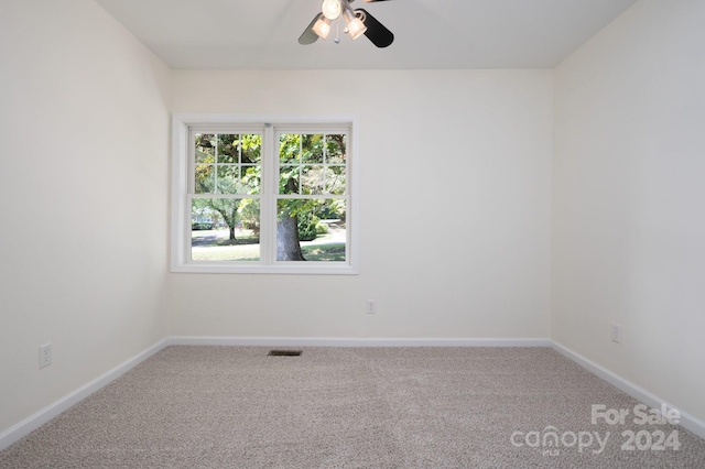 unfurnished room featuring carpet and ceiling fan