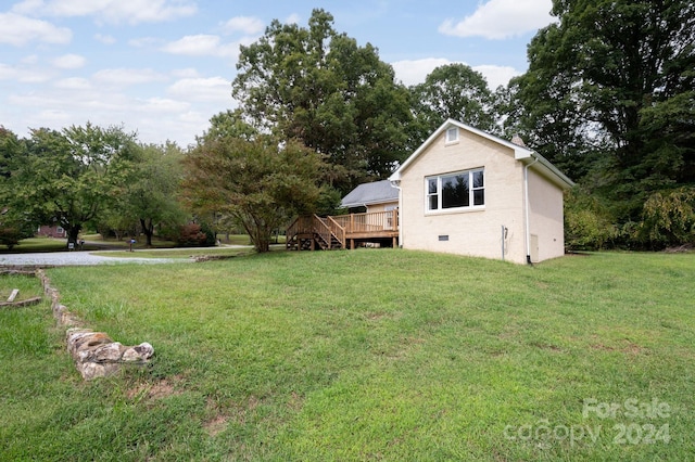 view of yard featuring a deck