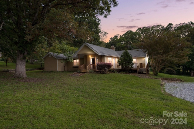 view of front of house with a yard