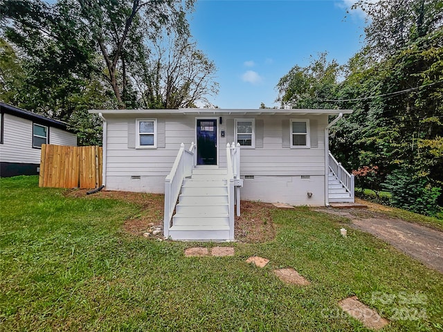 bungalow with a front yard