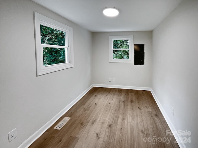 unfurnished room with light hardwood / wood-style flooring